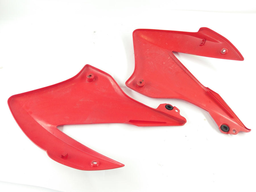 Honda XR 125 L JD19 [2005] - revestimento lateral à direita e esquerda com crack